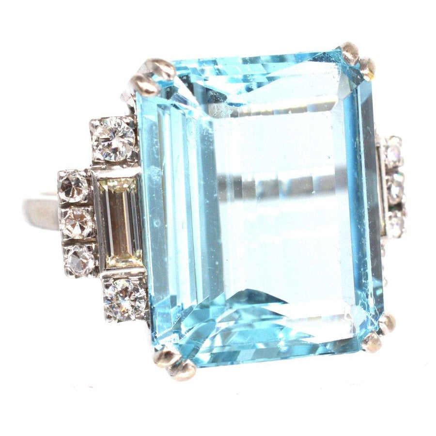 1940s platinum cocktail ring featuring a 16 carat aquamarine and diamond accents, showcasing exquisite Art Deco design.