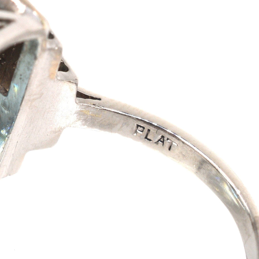 Close-up of 1940s platinum cocktail ring showing 'PLAT' hallmark on the band