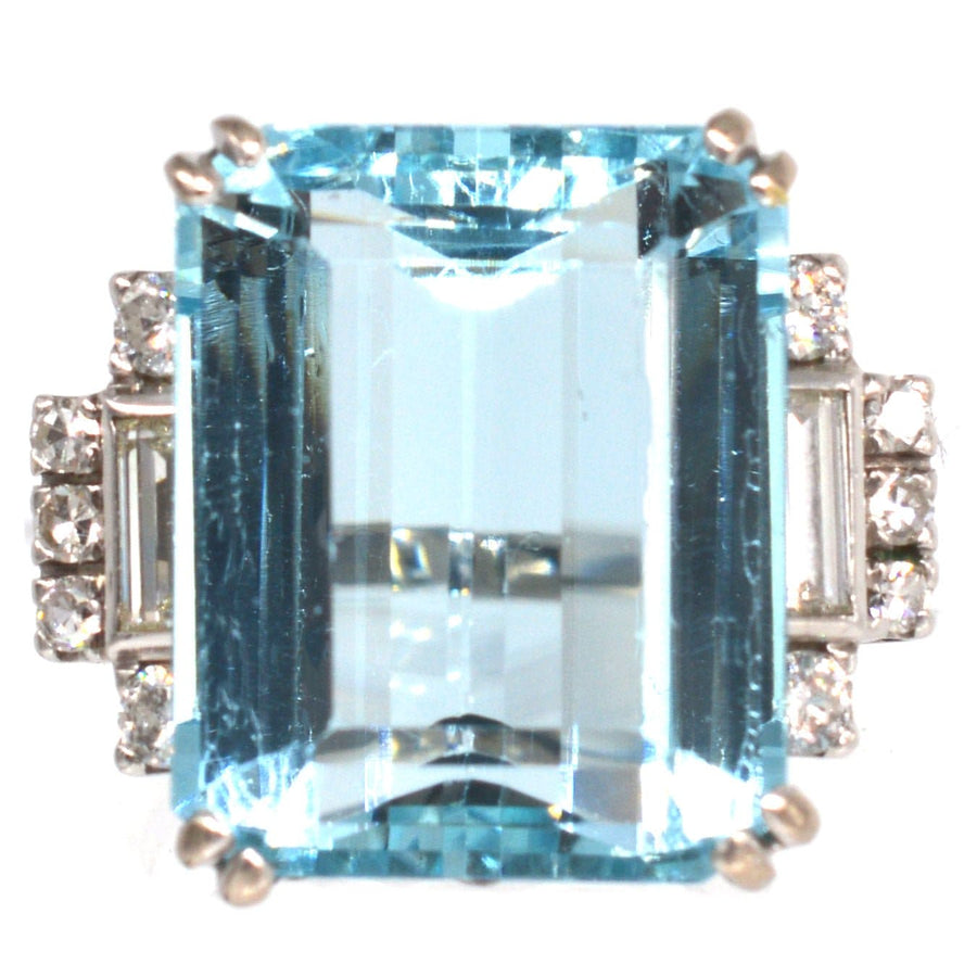 1940s platinum cocktail ring featuring a 16 carat emerald cut aquamarine and diamond accents.