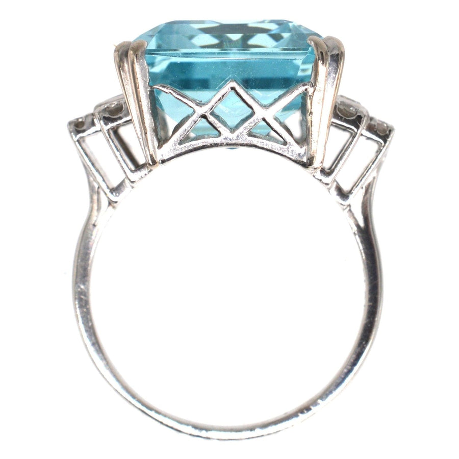 1940s platinum cocktail ring featuring a 16 carat emerald cut aquamarine and diamond accents.