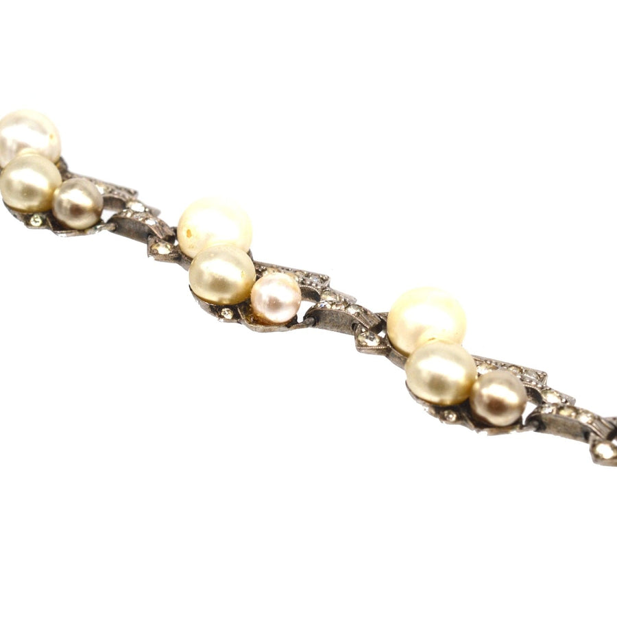 1940s Retro sterling silver bracelet featuring faux pearls and white paste stones, showcasing a stylish architectural design.