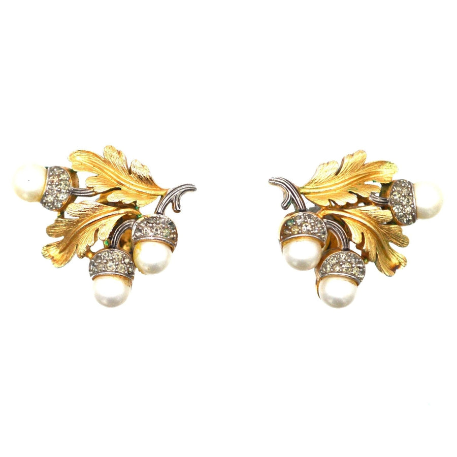 Vintage Trifari gold-tone oak leaf earrings with faux pearls and rhinestones, 1950s costume jewelry.