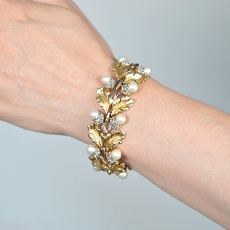 Gold-tone oak leaf bracelet with faux pearls and rhinestones from Trifari, circa 1950.