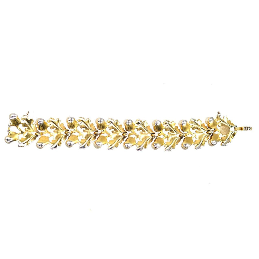 1950s Trifari gold-tone oak leaf bracelet with faux pearls, part of a matching jewelry set.
