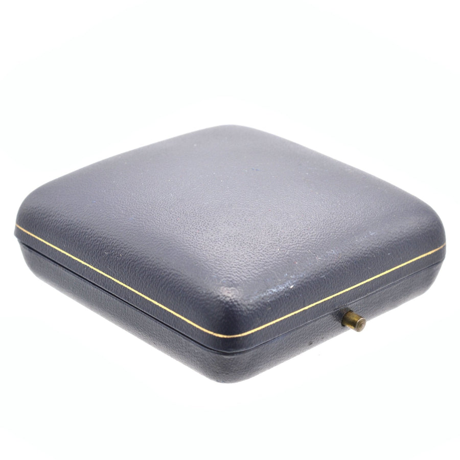 Vintage blue leather ring box with gold trim, perfect for storing jewelry.