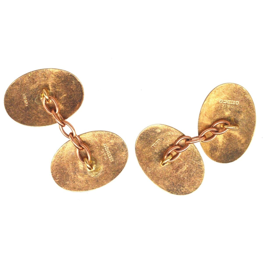 1960s 9ct gold engine turned cufflinks with elegant oval design and connecting chain, perfect for classic styling.