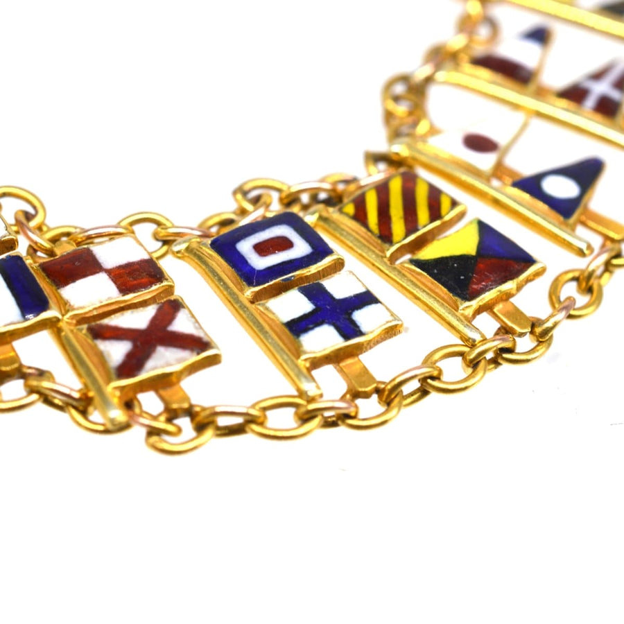 1960s 9ct gold bracelet featuring nautical signal flags representing the full alphabet and numbers 1-10.