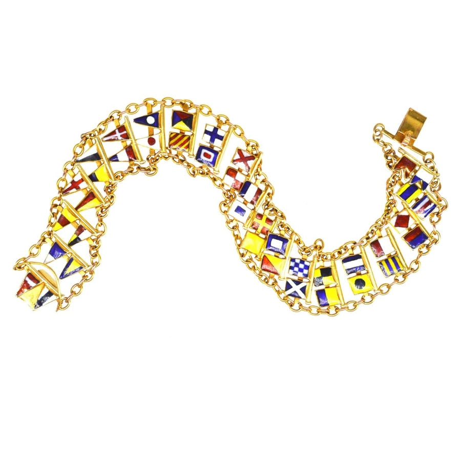 1960s 9ct gold nautical signal flag bracelet featuring full alphabet and colorful maritime flags.