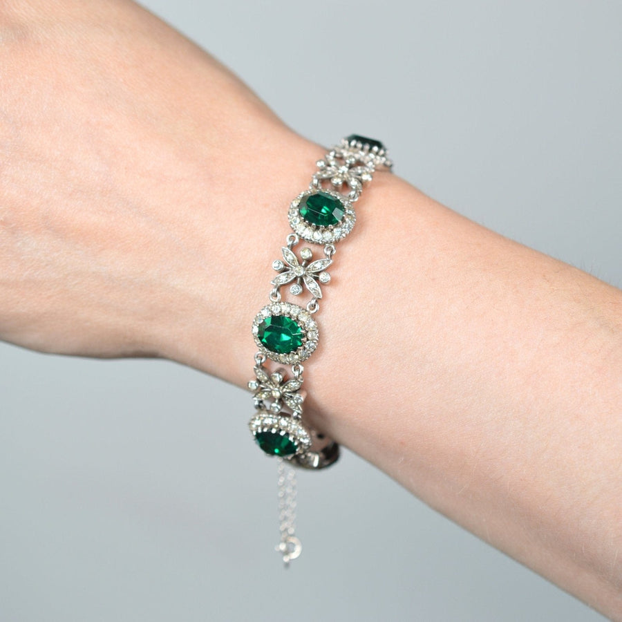 1960s green tourmaline paste bracelet with diamond paste accents, showcases elegant vintage jewelry style, worn on the wrist.