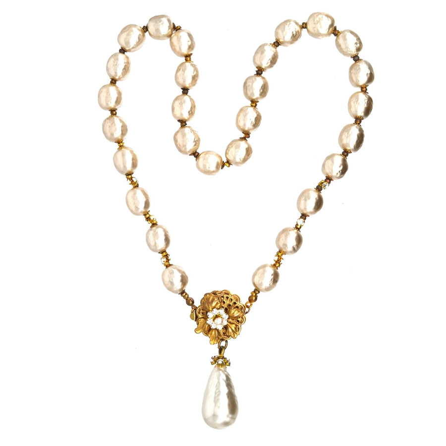 1960s Miriam Haskell faux pearl necklace featuring a flower clasp and large drop pearl pendant.