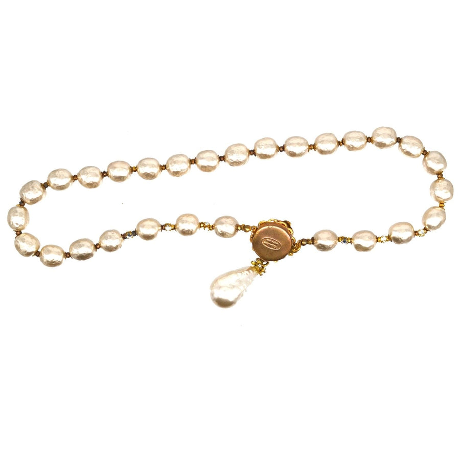 1960s Miriam Haskell faux pearl necklace with a teardrop pendant, showcasing vintage elegance and artistry.