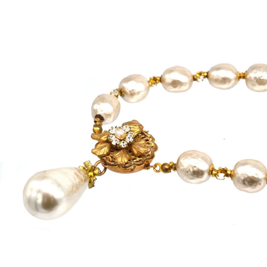 1960s Miriam Haskell faux pearl necklace with a decorative clasp and a teardrop pearl pendant.