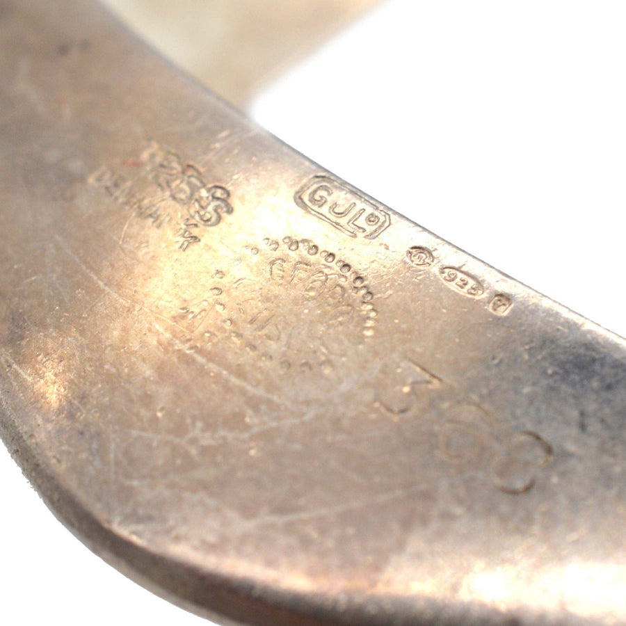 Close-up of hallmarks and design number 368 on a 1960s silver pendant by Henning Koppel for Georg Jensen.