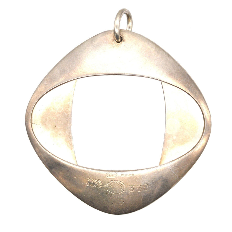 1960s silver Modernist pendant by Henning Koppel for Georg Jensen, design number #368, features a unique open oval shape.