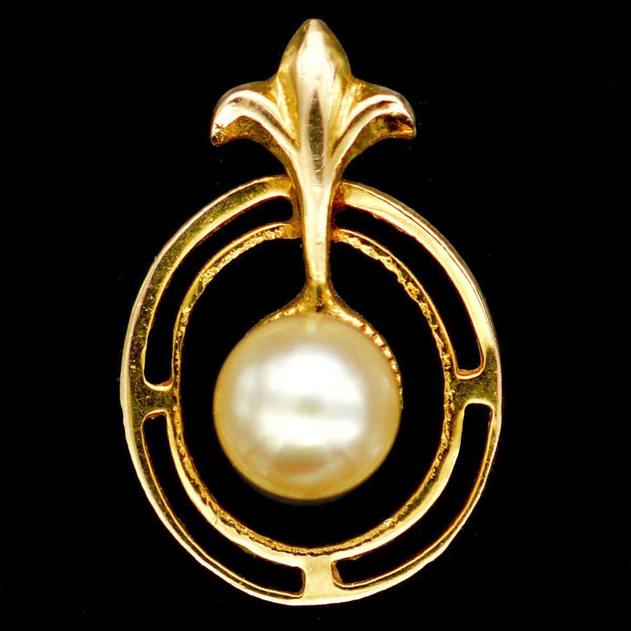 1970s 9ct gold and cultured pearl pendant featuring fleur-de-lis detail, elegant vintage jewelry.