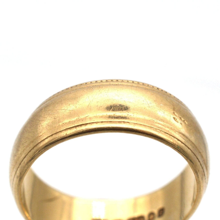 1970s 9ct gold wedding ring with decorated edges, 6.7mm width, hallmarked, elegant design for a timeless wedding piece.