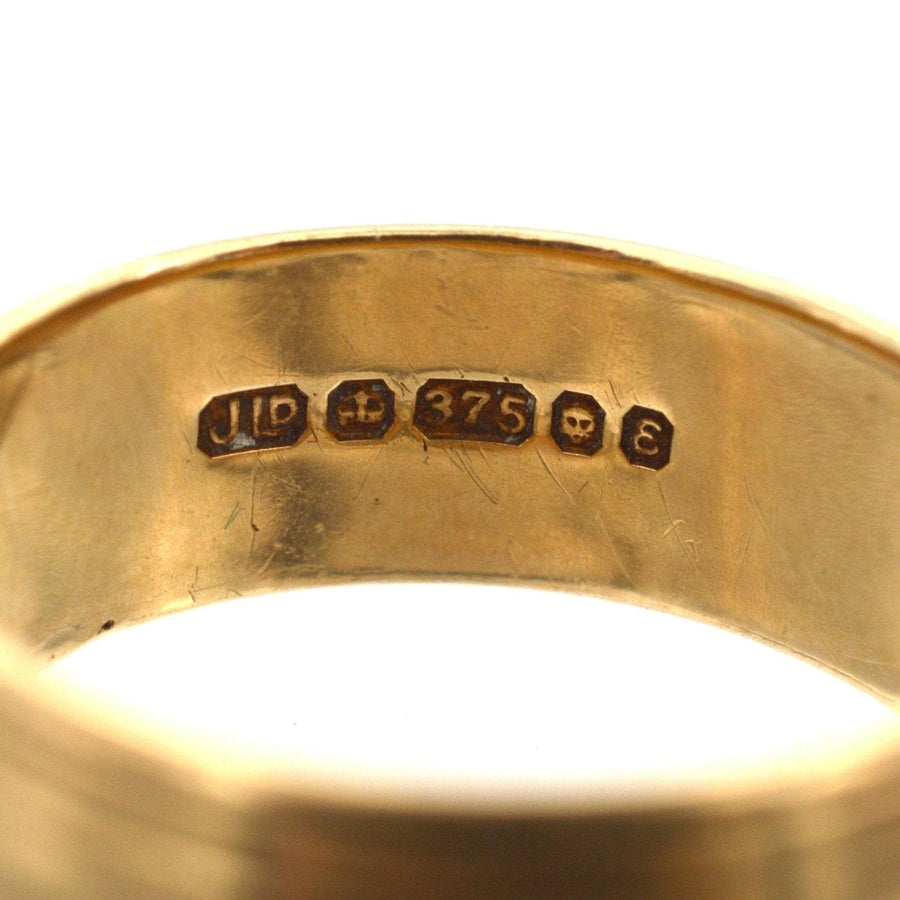 Hallmark details on a vintage 9ct gold wedding ring from 1979, showcasing authenticity and craftsmanship.