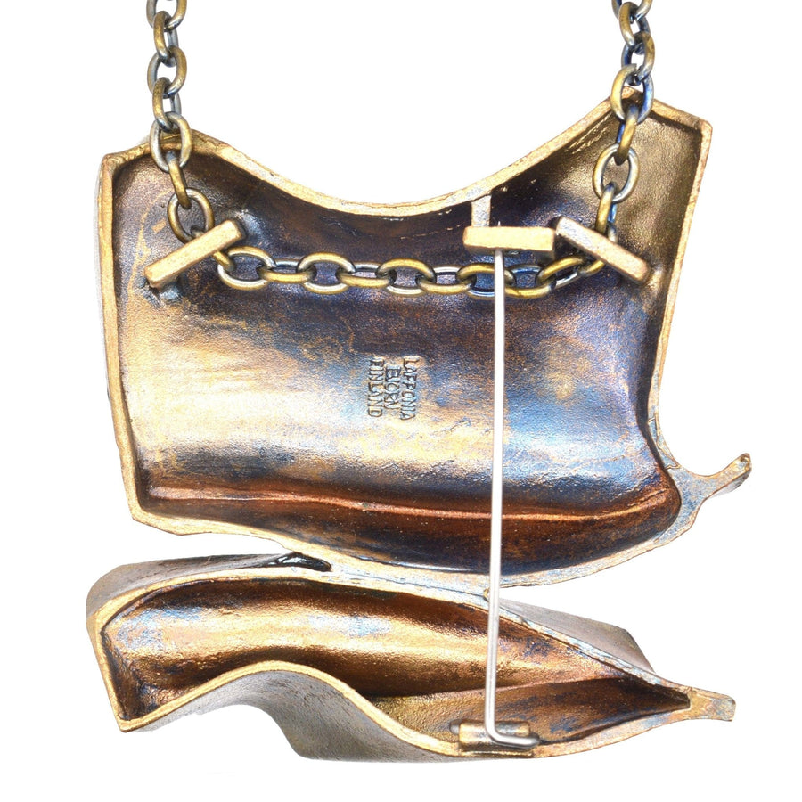 1970s Flame Bronze pendant/brooch by Björn Weckström featuring a unique industrial design and chain details.