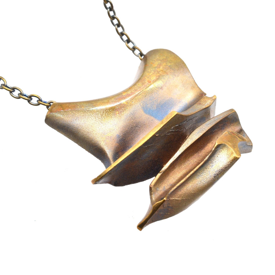 1970s Lapponia Daytona Flame Bronze pendant brooch by Bjorn Weckstrom, featuring brutalist design and unique finish.