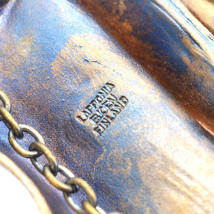 Close-up of Lapponia signature on 1970s Daytona Flame Bronze pendant brooch by Bjorn Weckstrom.