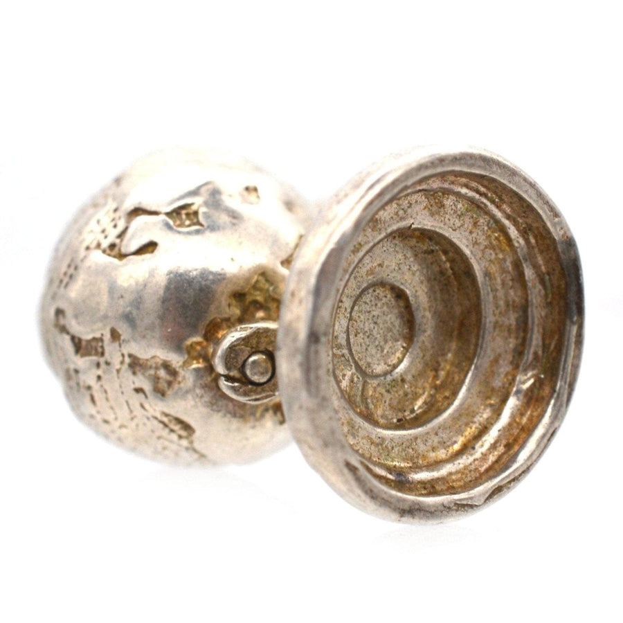 1970s silver antique globe charm and pendant with spinning feature, perfect for travelers and collectors.