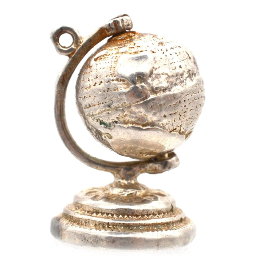 1970s silver antique globe charm pendant, a spinning globe design perfect for travel enthusiasts.