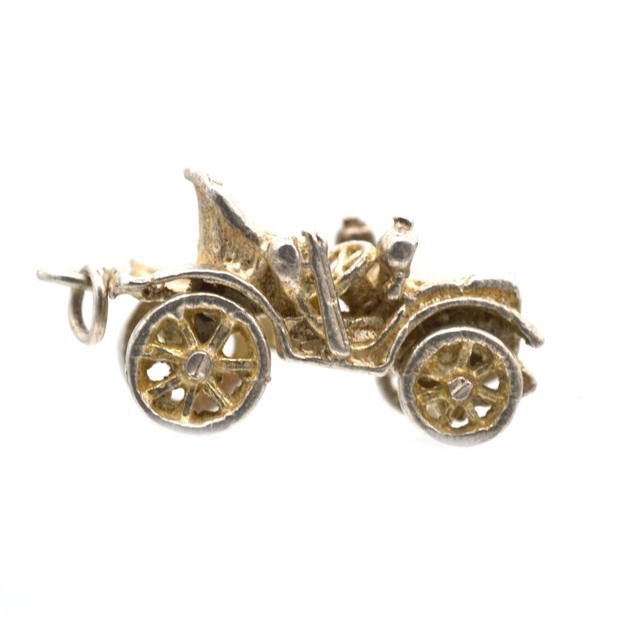 1970s silver vintage car charm pendant with moving wheels, playful design, possibly a Riley, perfect for collectors.