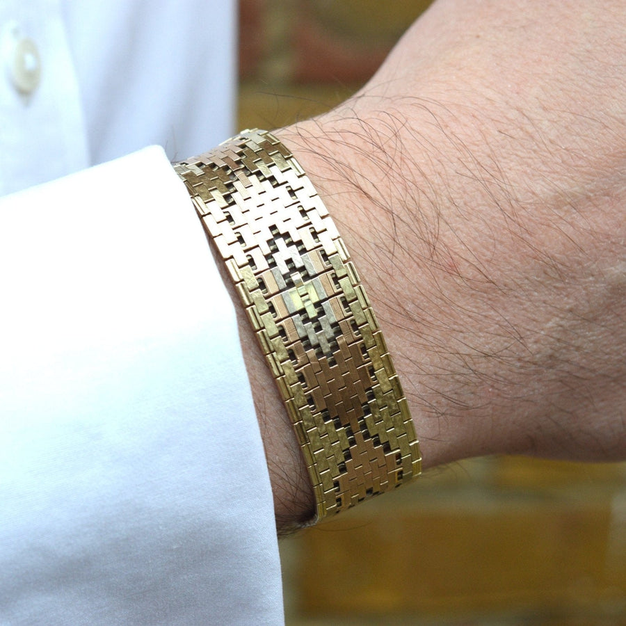 1970s three colour 9ct gold weave bracelet worn on wrist, showcasing geometric design and craftsmanship.