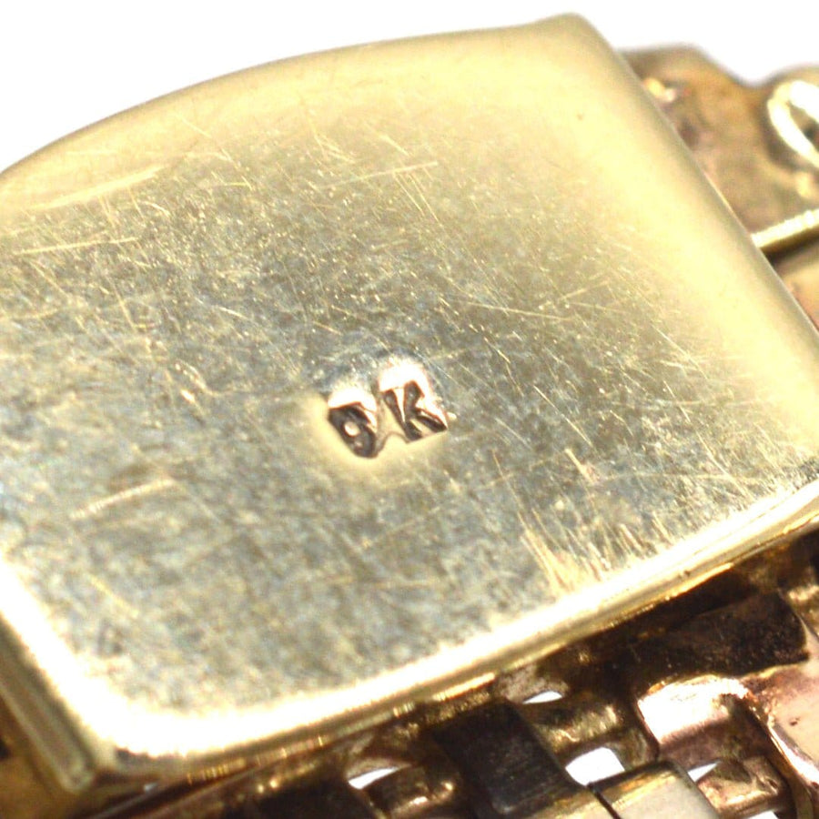 Close-up of the hallmark on a 1970s 9ct gold weave bracelet, showcasing quality and craftsmanship.