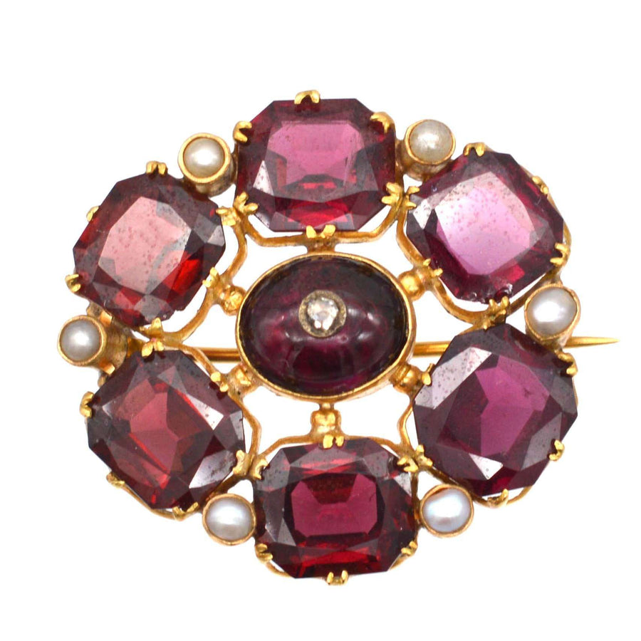 19th century gold brooch with garnet, pearl, and diamond in cluster design, ideal birthday gift for January.