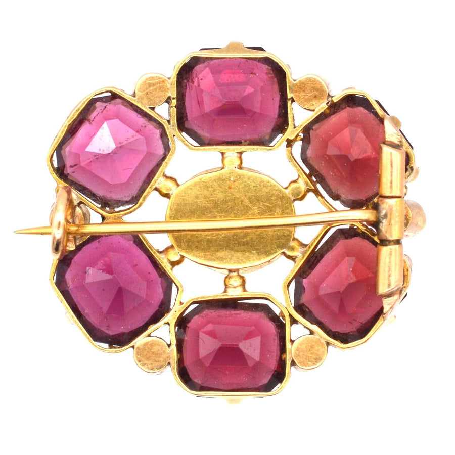 19th century gold brooch featuring garnets, pearls, and diamonds, perfect gift for January birthdays.