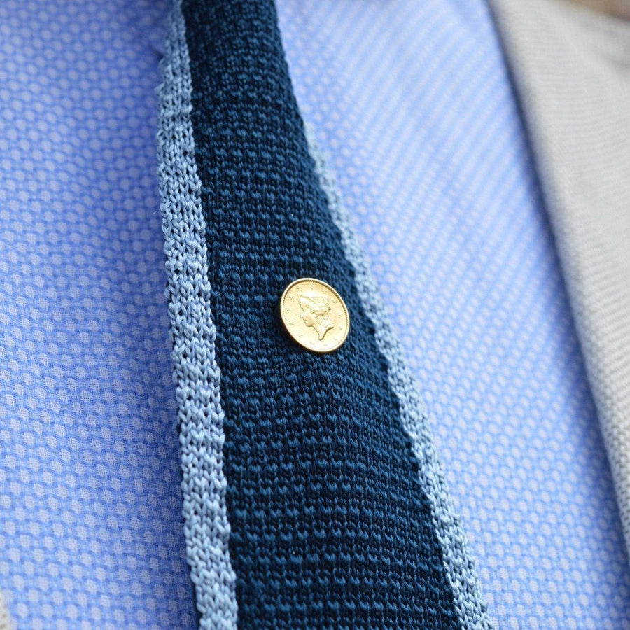 19th Century American Gold $1 Liberty Head tie pin displayed on a stylish tie, showcasing elegance and historical significance.