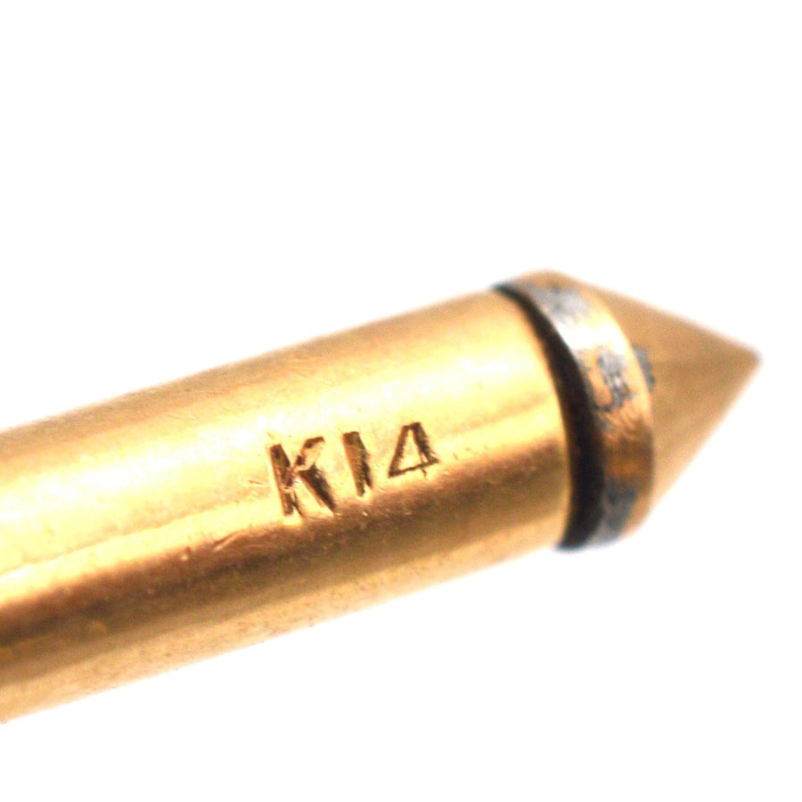 Close-up of a K14 gold marking on jewelry, showcasing quality craftsmanship in gold jewelry design.