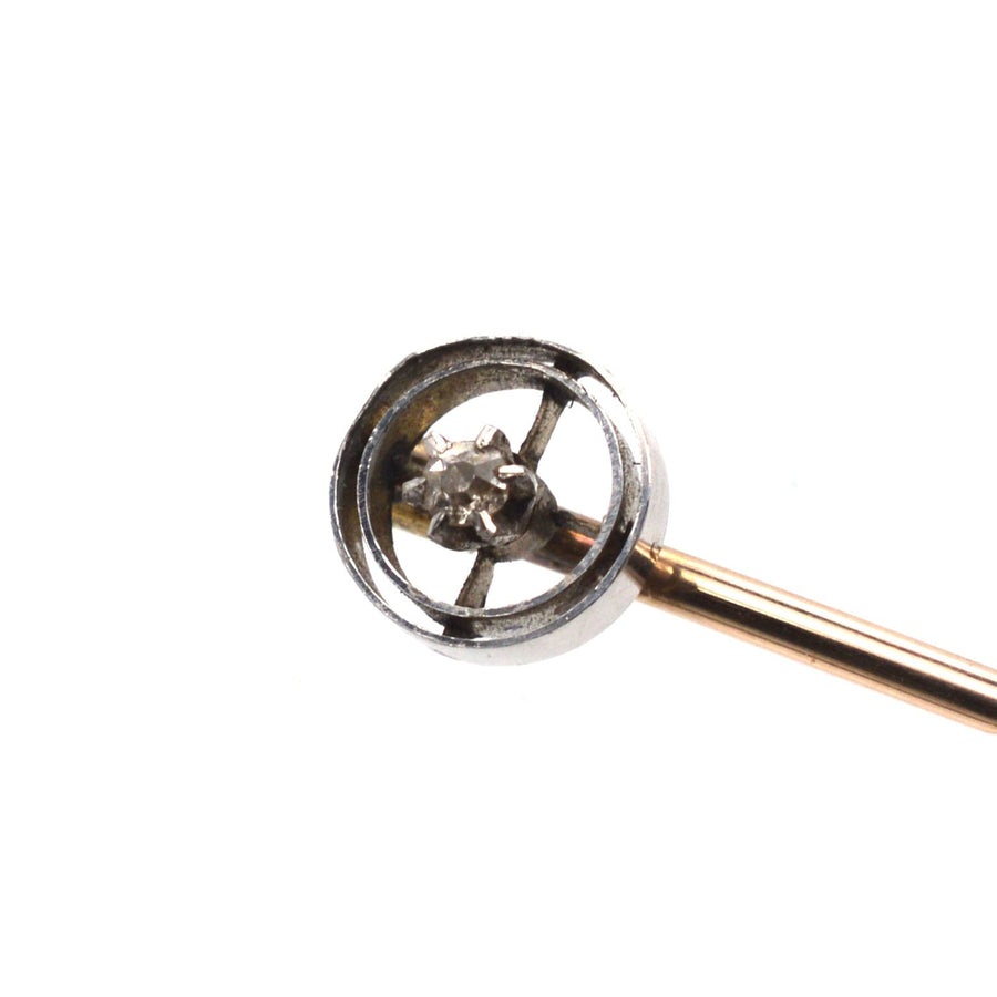 Art Deco 14ct white gold and diamond circle tie pin, featuring a sparkling diamond and platinum circlets.