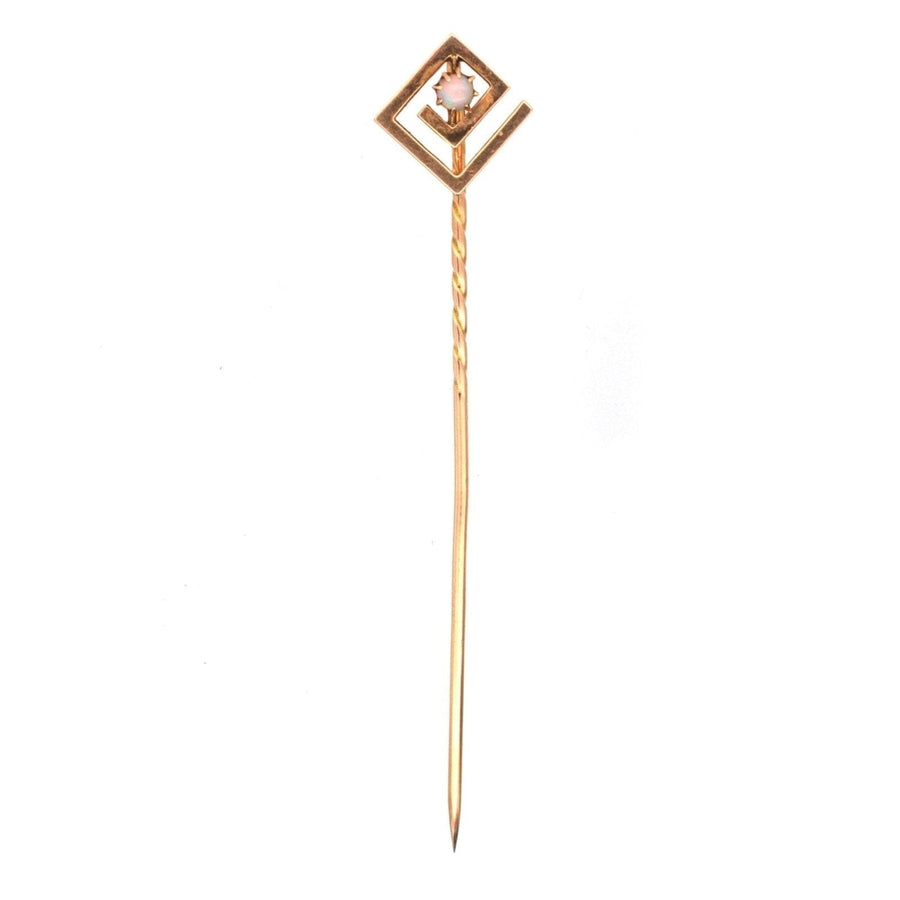 Art Deco gold tie pin featuring a geometric design and an opal gemstone, stylish accessory for silk ties.