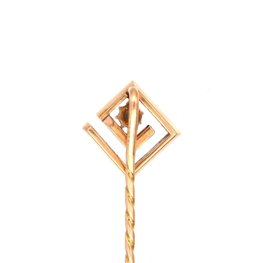 Art Deco 15ct gold tie pin featuring a geometric design and opal, perfect for stylish silk ties.