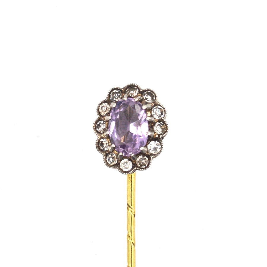 Art Deco 18ct gold tie pin featuring an amethyst and white paste cluster, crafted between 1915-1925.