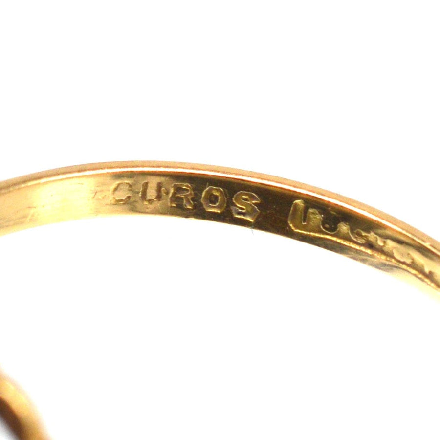 Close-up of the inner band engraving on an 18ct gold tiara ring, showcasing exquisite craftsmanship and detail.