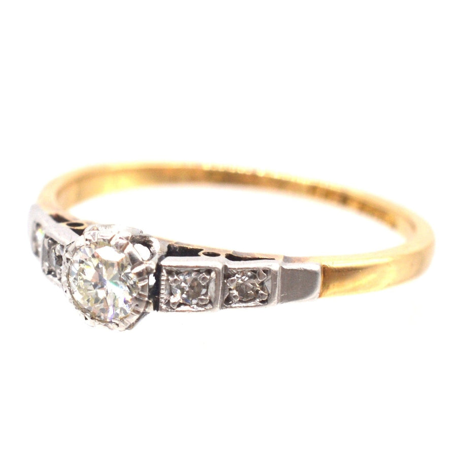 Art Deco 18ct gold and platinum diamond solitaire ring with diamond shoulders, perfect for an elegant engagement.