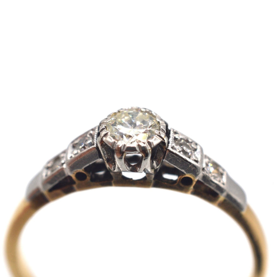 Art Deco 18ct gold and platinum diamond solitaire ring with diamond shoulders, perfect for engagements.