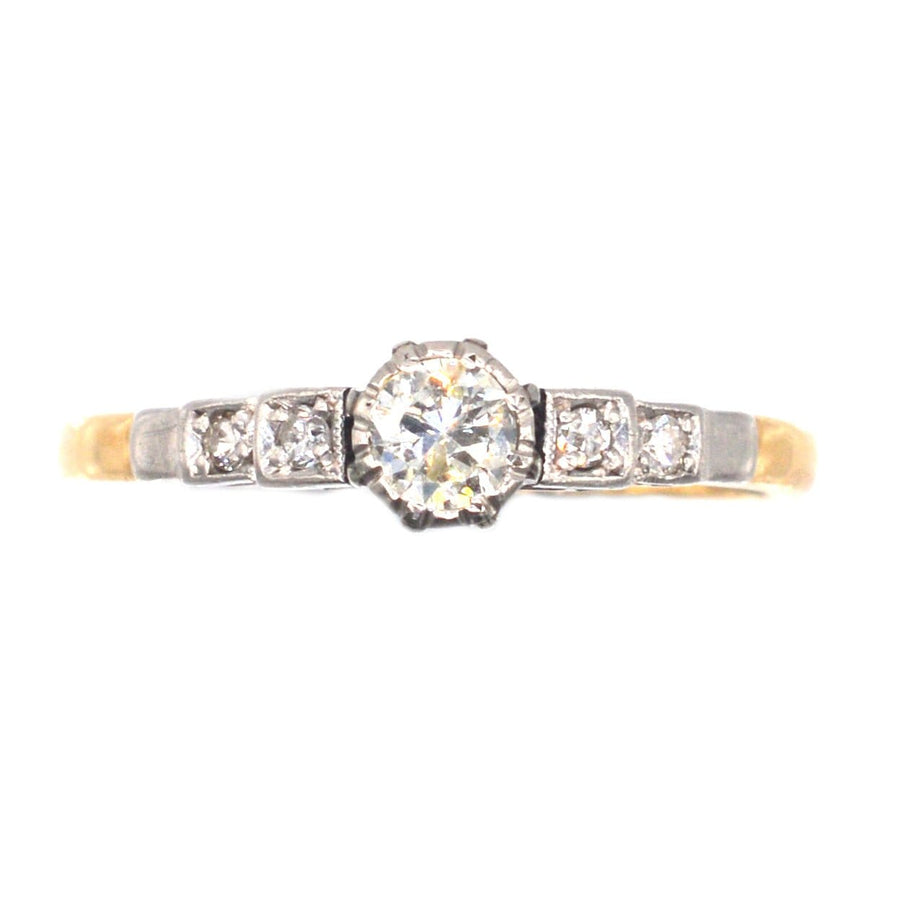 Elegant Art Deco 18ct gold and platinum diamond solitaire ring with diamond shoulders, perfect for engagements.
