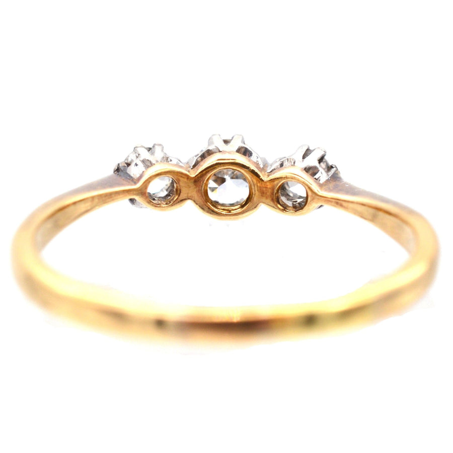 Art Deco 18ct gold and platinum three stone diamond ring, antique engagement ring from 1930s by Henry Griffith & Sons.