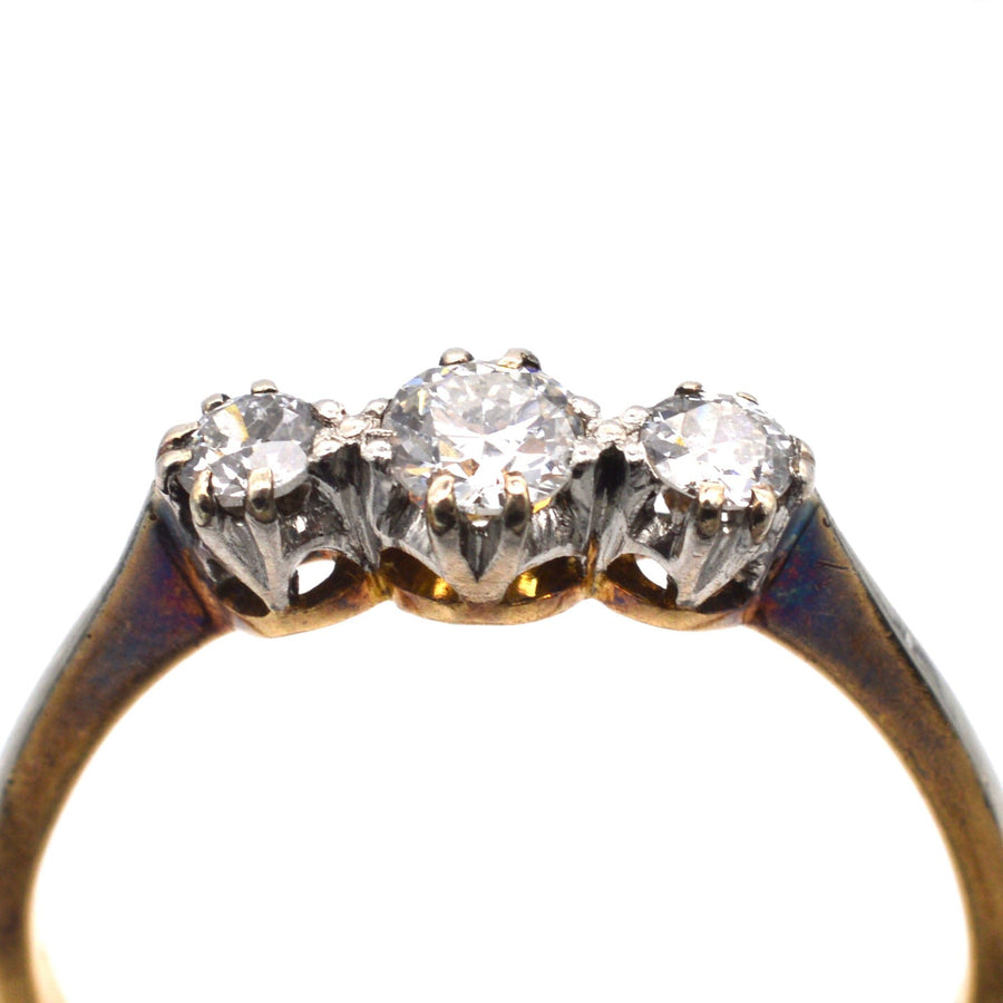 Art Deco 18ct gold and platinum three stone diamond ring, antique jewelry from the 1930s.