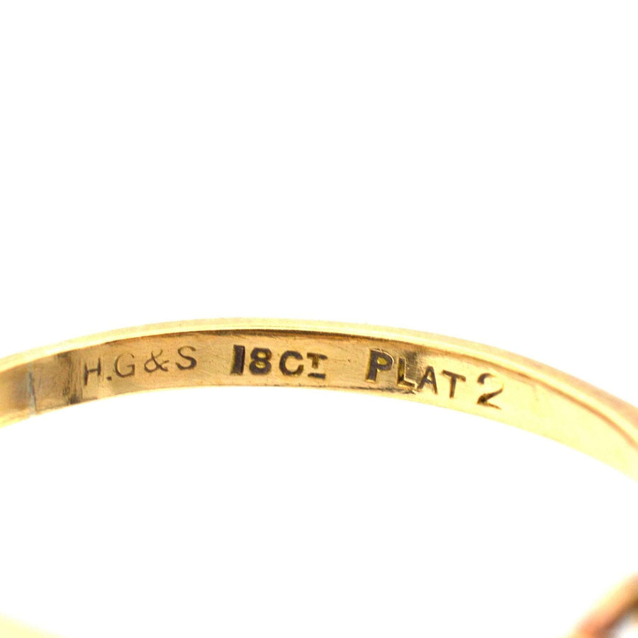 Close-up of the hallmark inside an Art Deco 18ct gold and platinum ring by Henry Griffith & Sons.