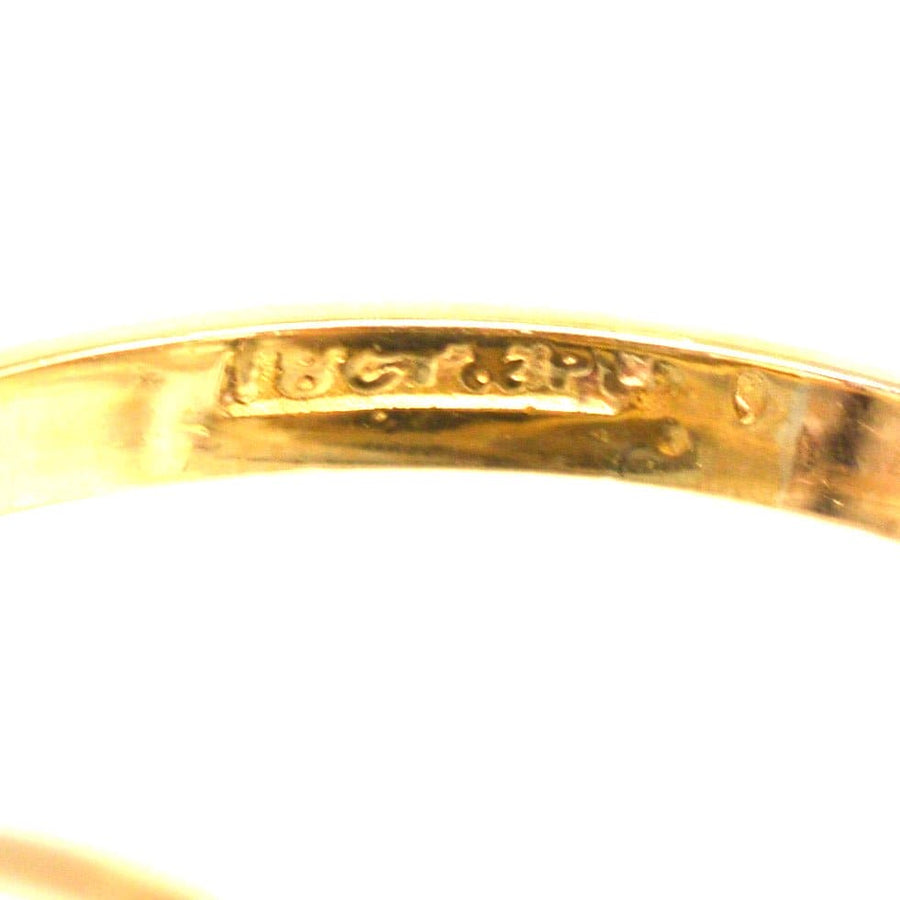 Inside view of an Art Deco gold and platinum ring showcasing its hallmark and intricate detailing.