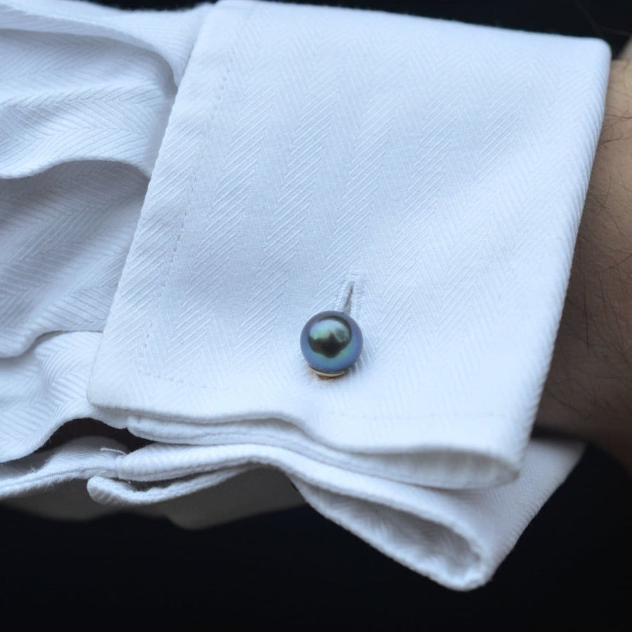 Art Deco 18ct gold cufflinks featuring Tahitian cultured pearl on a crisp white dress shirt.