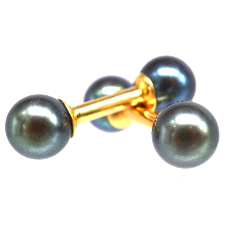 Art Deco 18ct gold cufflinks featuring Tahitian cultured pearls, perfect for a modern, elegant look.