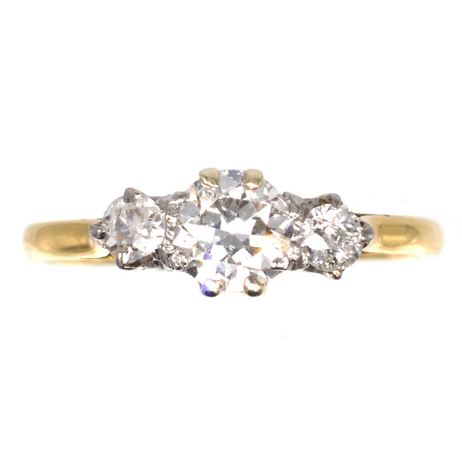Art Deco 18ct gold three stone ring with transitional cut diamonds, total 0.75 carats, classic and elegant design.