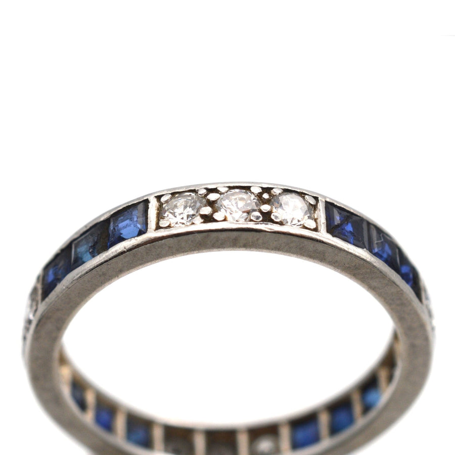 Art Deco 18ct white gold sapphire and diamond eternity ring showcasing blue sapphires and sparkling diamonds.