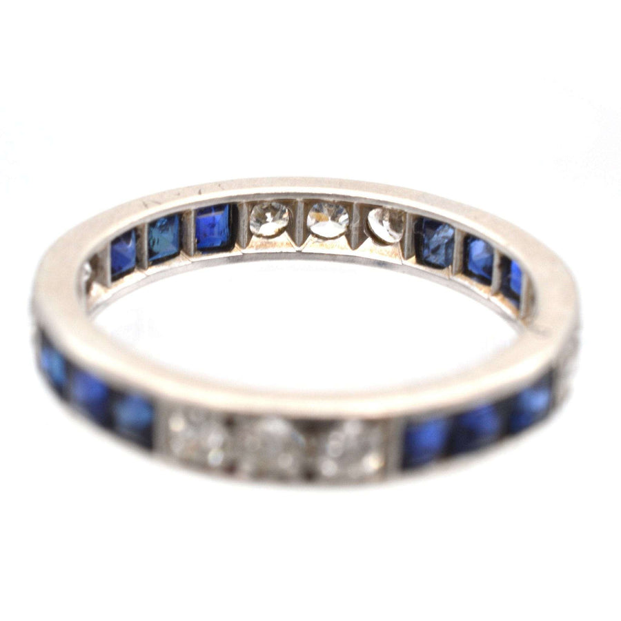 Art Deco 18ct white gold sapphire and diamond eternity ring, featuring blue sapphires and sparkling diamonds.